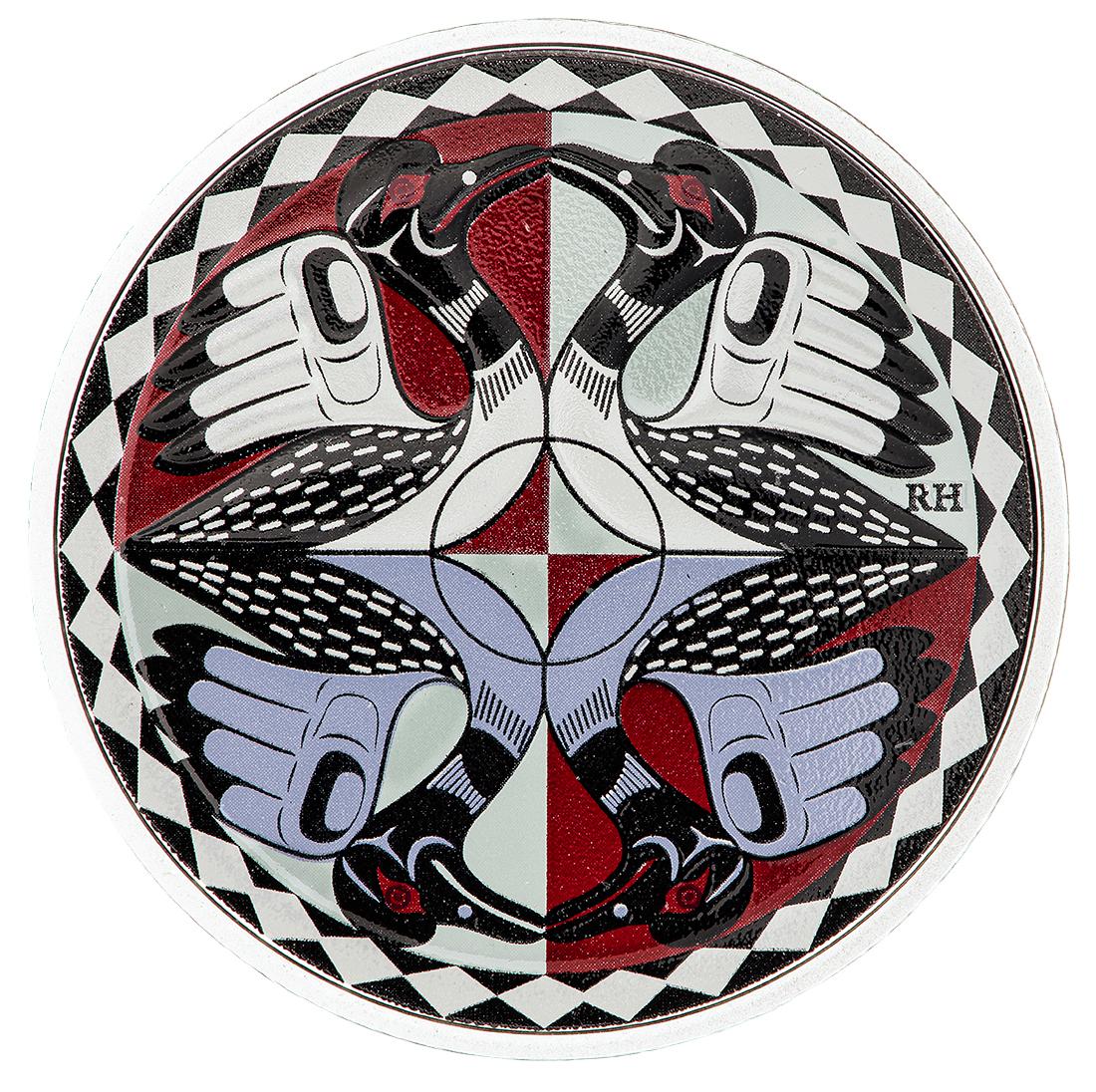 Coin, silver, divided into quarters each with a stylized bird, on backgrounds of red, blue and turquoise.