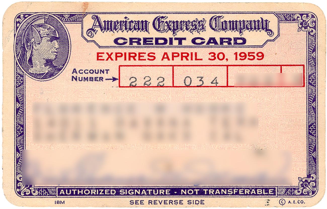 Credit card, cream, purple ink, frame of elaborate geometric patterns, profile of man wearing feathered helmet.