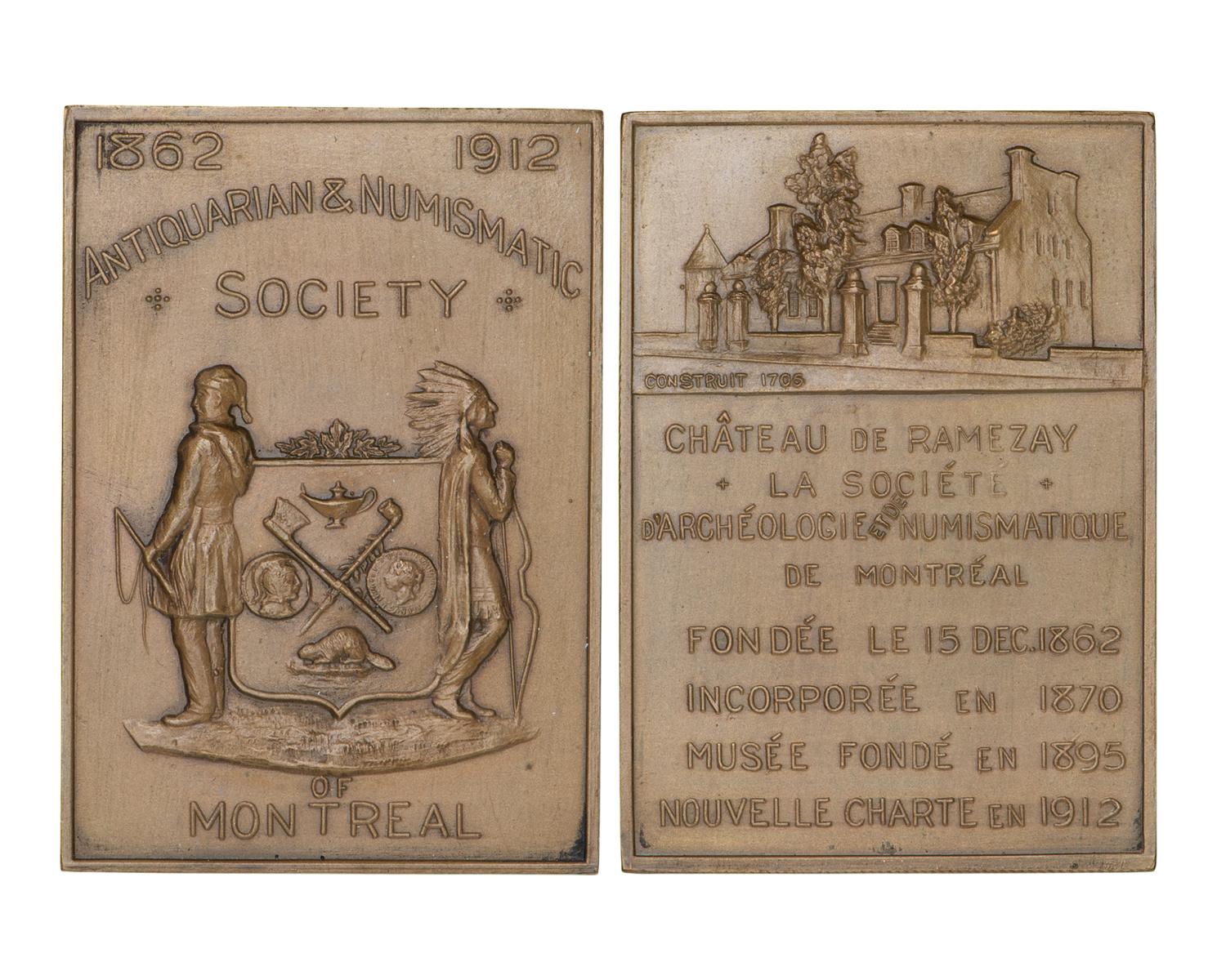 Medal, rectangular, vertical, coat of arms on one side, an old mansion and many words on the other.
