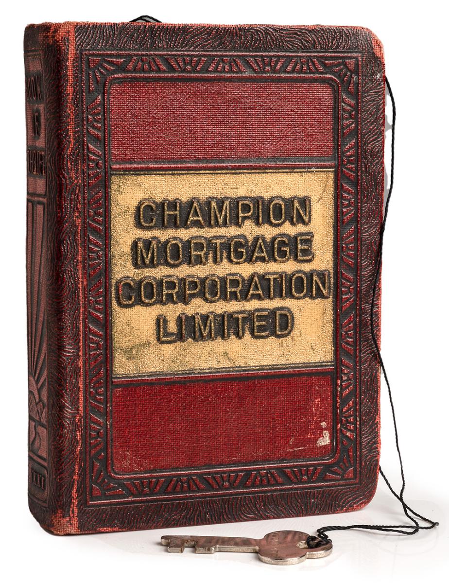 Box resembling a book with a chain and key.