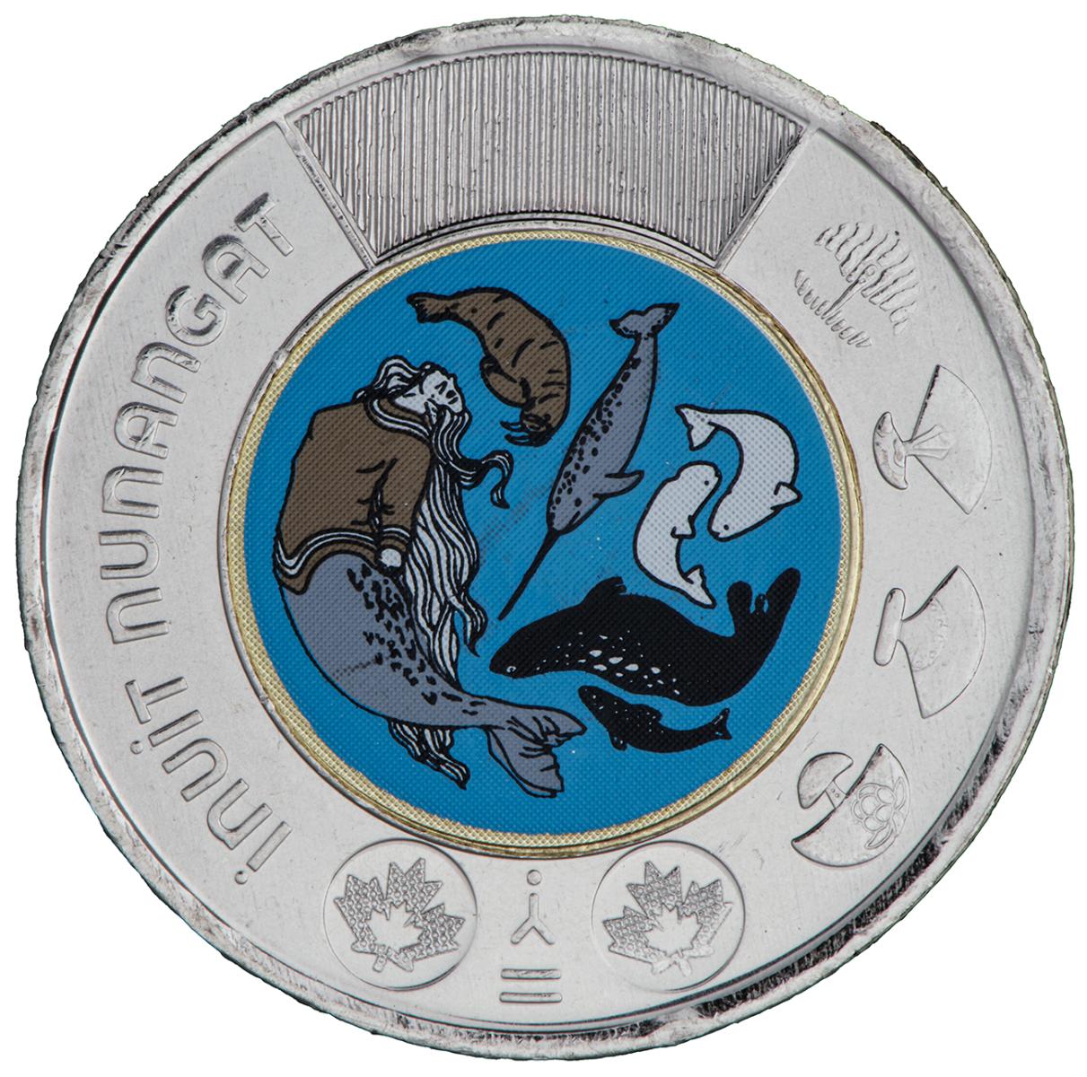 Coin, a silver-coloured rim with cultural icons, the core a colourful image of whale types.