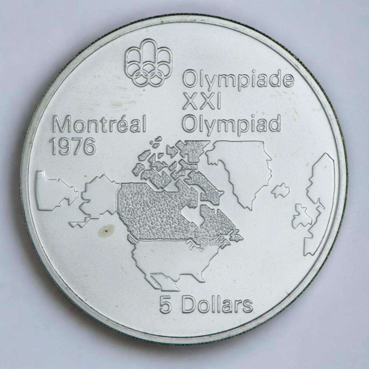 Coin, silver, map of North America outline with Canada darkened.