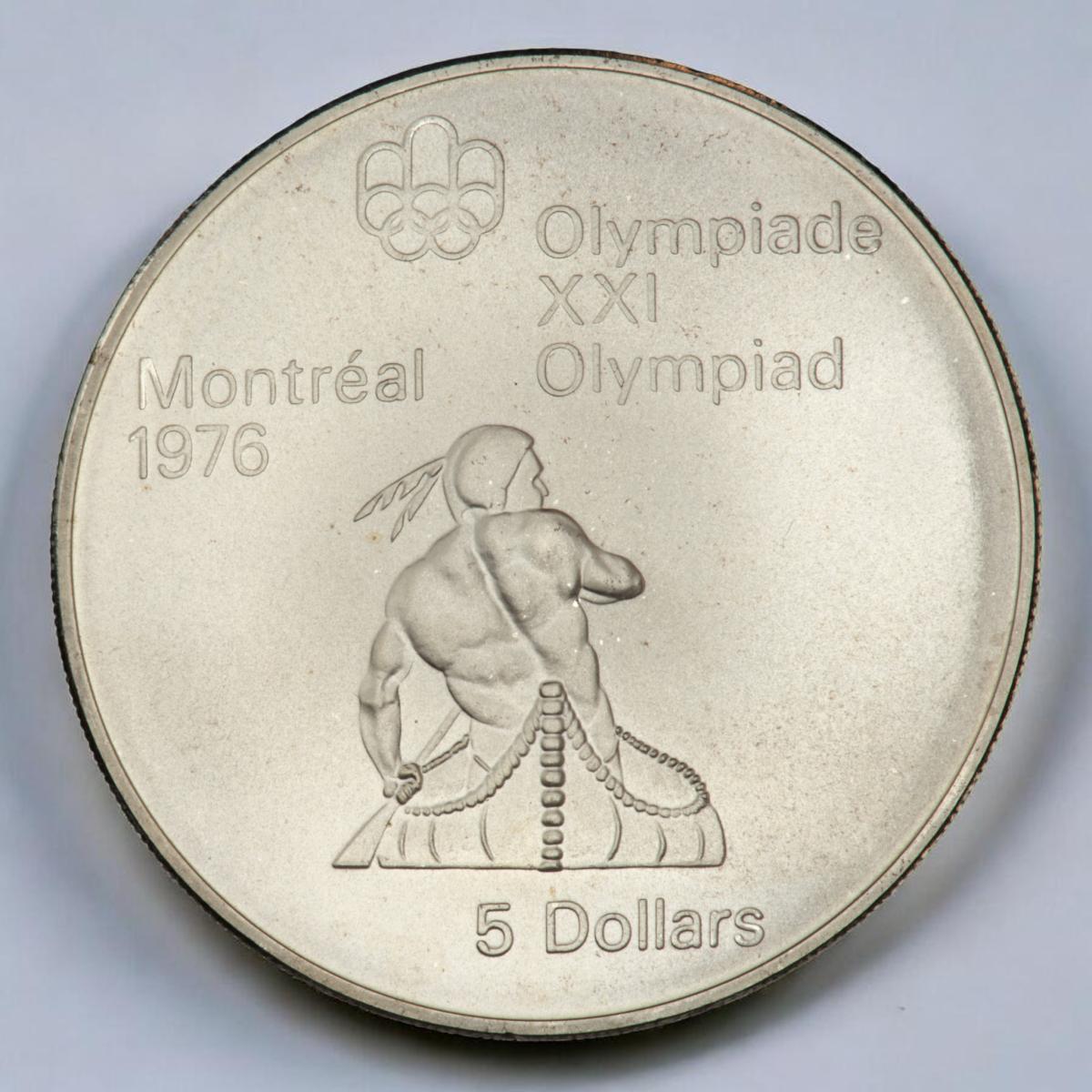 Coin, round, muscular Indigenous man paddling a canoe away from the viewer.