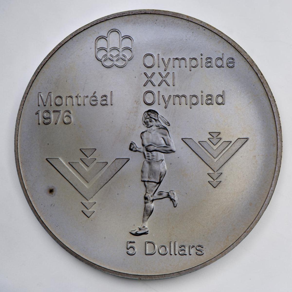 Coin, silver, Indigenous man in loin cloth running, motif of stacked, inverted “V” shapes on either side.