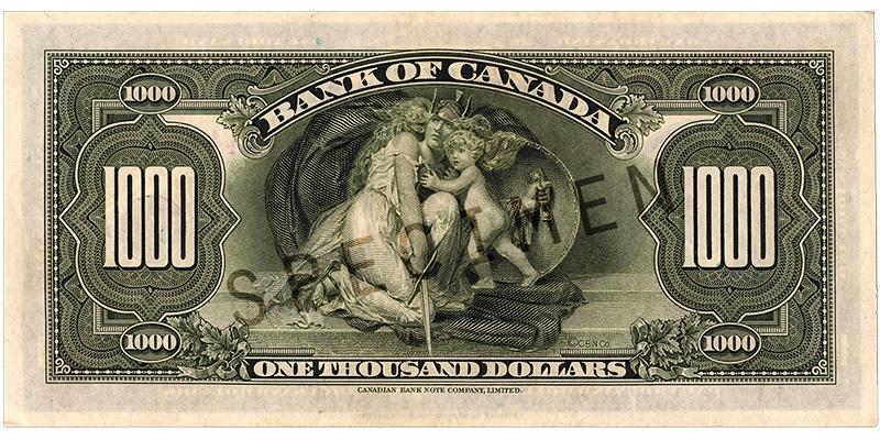1935_1000-dollar_verso_EN Bank note, pale green, elaborate geometric patterns, a robed woman in a helmet protecting a child with a shield.