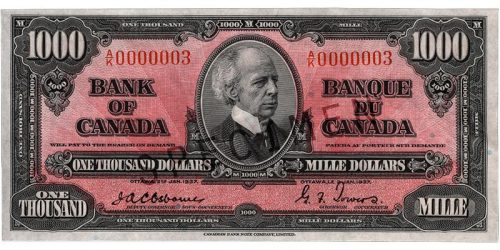 Bank note, pink, elaborate geometric patterns, a balding man in an old-fashioned high-collared suit: Sir Wilfrid Laurier.