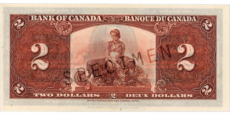 1937_2-dollar_verso Bank note, terracotta pink, elaborate geometric patterns, a robed woman sitting among harvest vegetables and holding a scythe.
