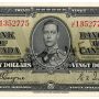 Bank note, pale green, cropped, elaborate geometric patterns, a young man in an old-fashioned military uniform: King George VI.