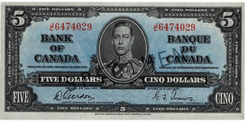 Bank note, blue, elaborate geometric patterns, a young man in an old-fashioned military uniform: King George VI.