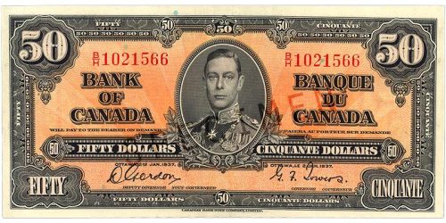 Bank note, orange, elaborate geometric patterns, a young man in an old-fashioned military uniform: King George VI.