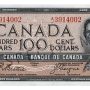 Bank note, brown, a frame of geometric patterns, a young woman with curly hair and a pearl necklace: Queen Elizabeth II.