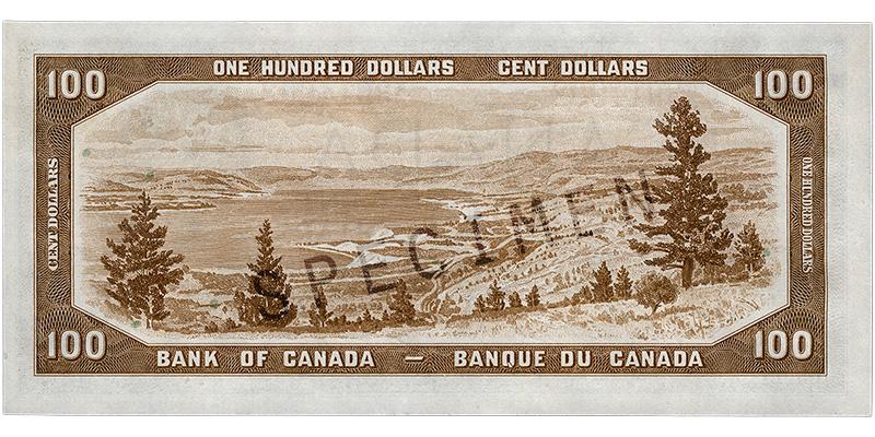 Bank note, brown, a frame of geometric patterns, a large lake among low mountains with a foreground of evergreen trees.