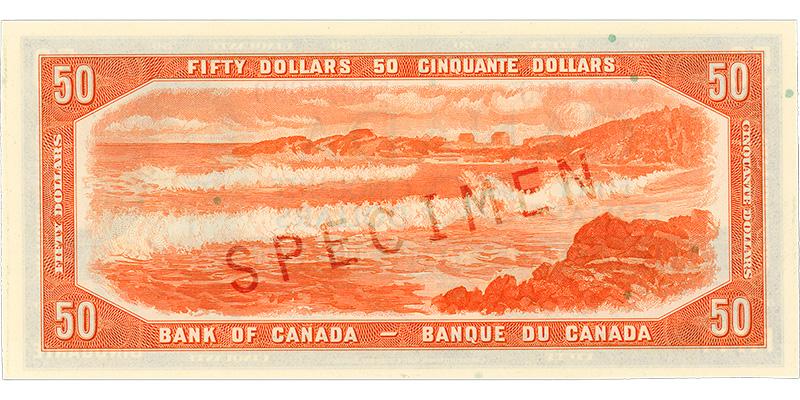 1954-50-dollar-verso Bank note, orange, a frame of geometric patterns, long ocean waves crashing on a beach, a low rocky headland behind.