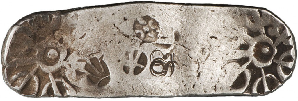 oblong, stamped piece of silver.