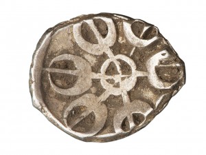 irregularly shaped stamped coin