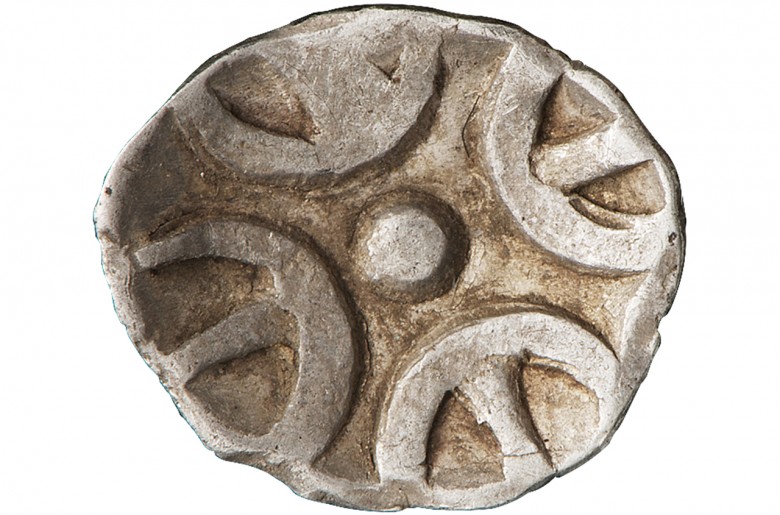 irregularly shaped stamped coin