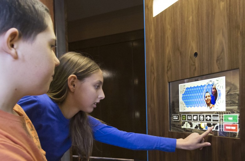 Children operating a touch panel