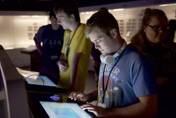 young man working on touch panel