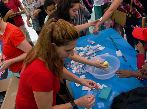 people applying temporary tattoos