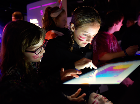 kids working on a touch screen