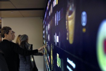 visitors interacting with a digital wall