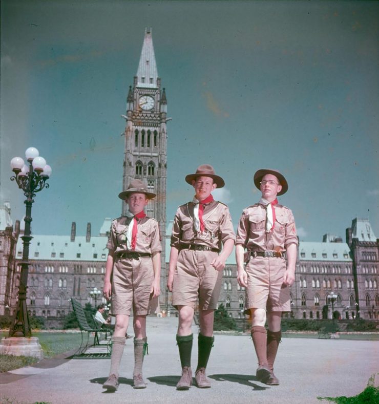 early colour photo, 3 boy scouts in front of Parliament