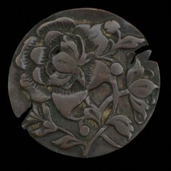 Hand engraved token with floral pattern