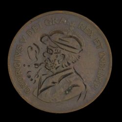 Hand engraved token with man smoking