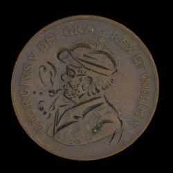 Hand engraved token with man smoking