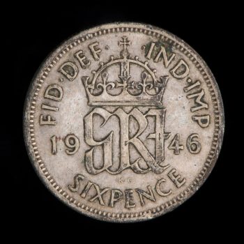 Old British coin with crown symbol