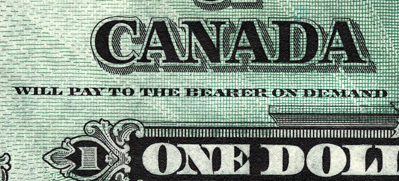 close up of message on bank note “Will pay to the bearer on demand” close up of message on bank note “Will pay to the bearer on demand”