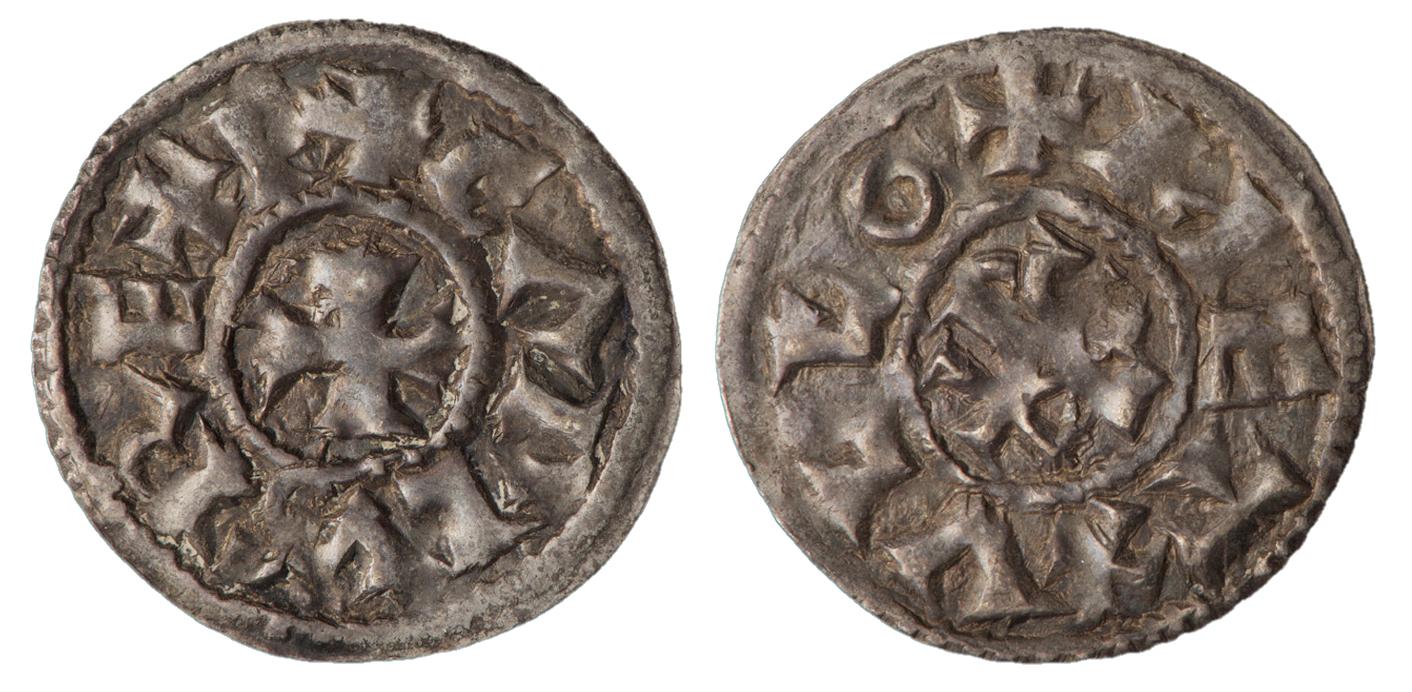 Two sides of a coin with a cross in the centre and lettering around the rim.