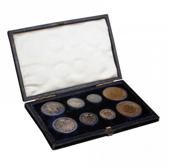 Set of eight coins in a velvet-lined box.