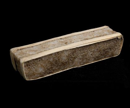 Long, light brown rectangular brick of salt.