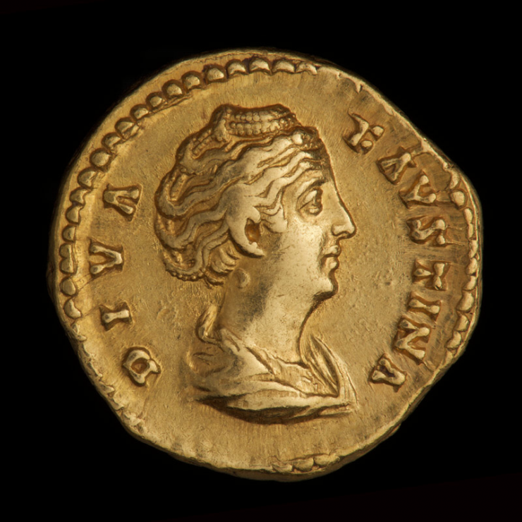 Coin, gold, a woman’s portrait facing right and words along the edge.