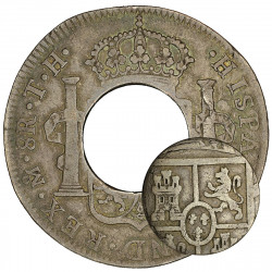 Coin, silver, circular with a round hole punched out of the middle and a smaller coin the size of the hole.