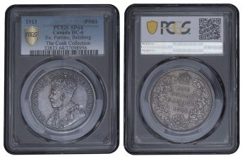 Coin, both sides, in a clear case, one side with a crowned king and the other with a wreath of maple leaves.