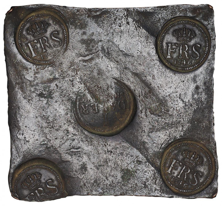 Metal plate, square with 5 round official symbols stamped on it.