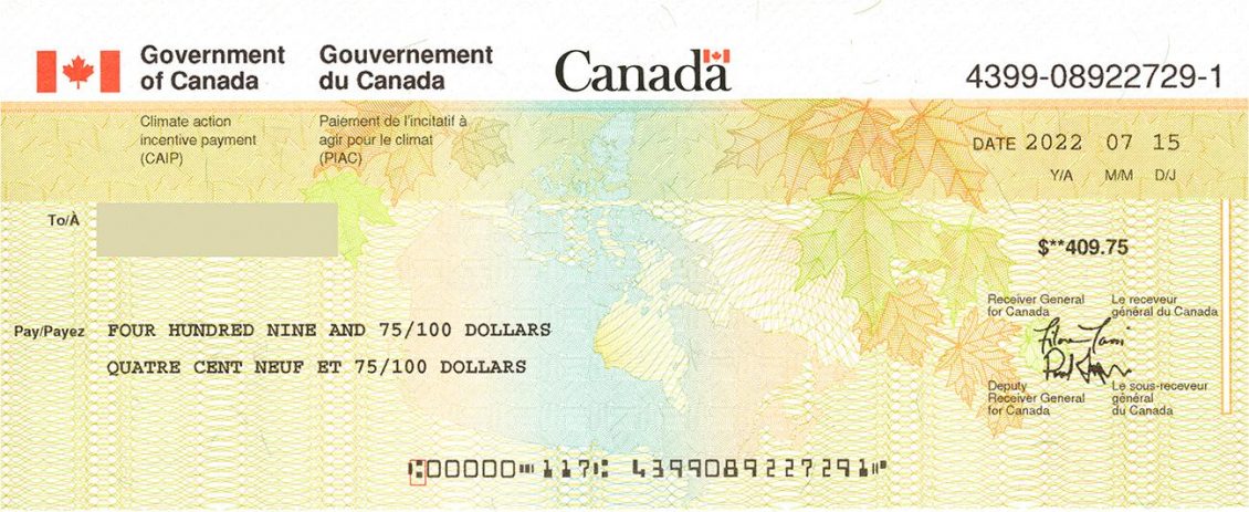 Cheque, Canadian flag at top, patterns of maple leaves and map in bottom two-thirds.