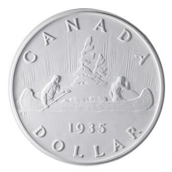 Plaster relief carving of a coin showing two men paddling a canoe past an island with a wind-swept pine tree.