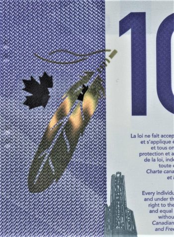Bank note, cropped, microscopic purple printing behind a feather printed on reflective foil.