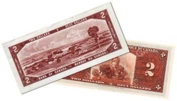 Two bank notes, one highly decorative, the other a simple landscape.