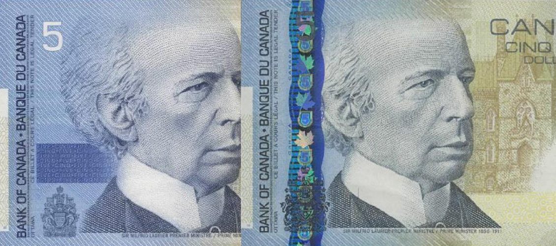 Overlapping bank notes, the same basic notes, one with a colourful, vertical metallic band.