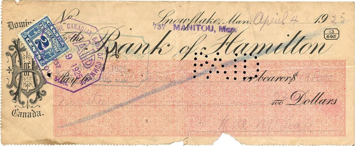 Small document, old, printed script, bank monogram and seal, blue tax stamp and perforations that spell the word paid.