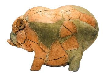 Clay pig, broken and reassembled Model pig, ceramic, reassembled from many broken pieces.