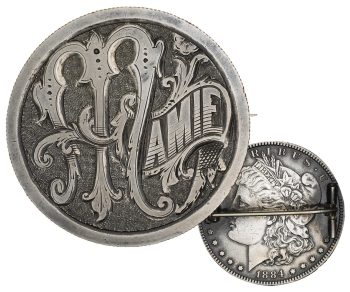 Coin, re-engraved with a highly stylized name, Mamie, and transformed into a brooch.