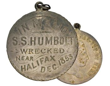 Coin, silver, a loop attached, one side smoothed and words engraved on it in a decorative manner.