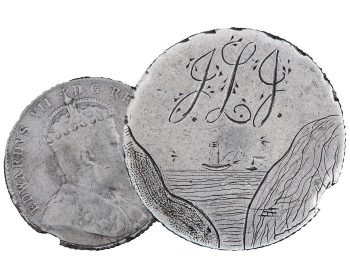 Coin, smoothed flat, roughly engraved, a view of ocean seen from between two rocks, with sailing ships, initials over top and a crowned king on the back.