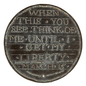 Coin, copper, smoothed and words inscribed upon it.