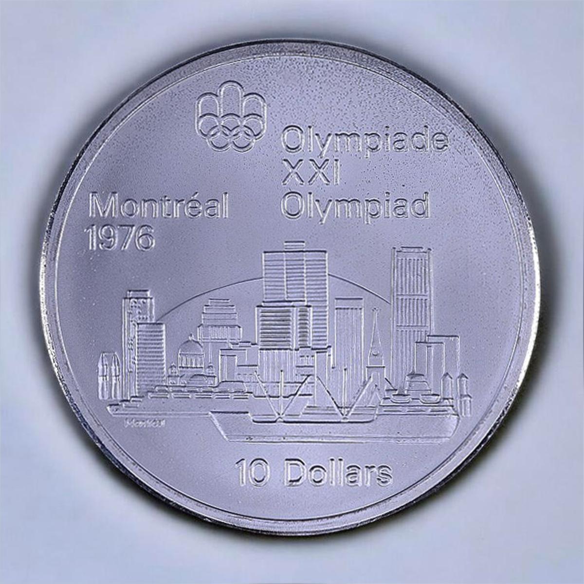 Coin, silver, a harbour with a large cargo ship before a modern city of sky scrapers.